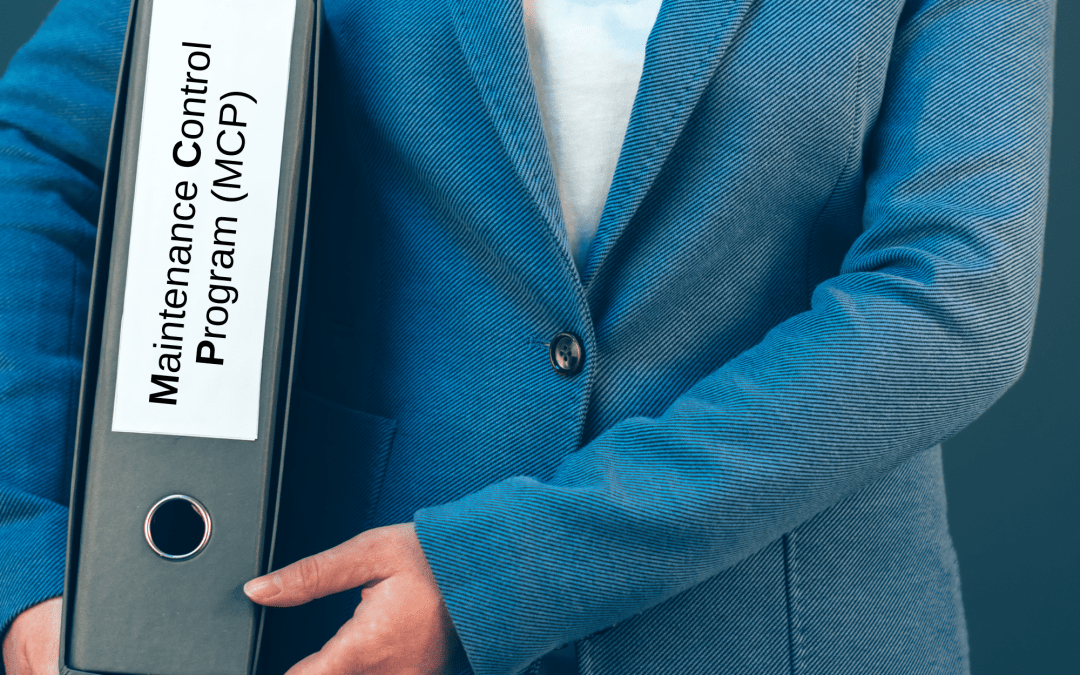 Technician reviewing Aligned Elevator’s Maintenance Control Program documentation