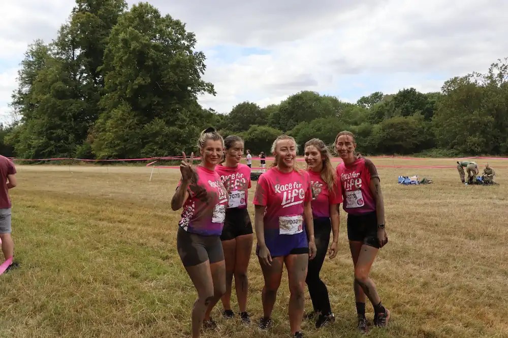 All Clean London team posing together at the Race for Life Pretty Muddy 5k 2026