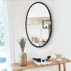 Black Oval Metal Wall Mirror with Wooden Back