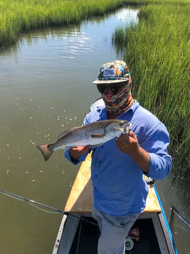 fly fish from canoe catching fish