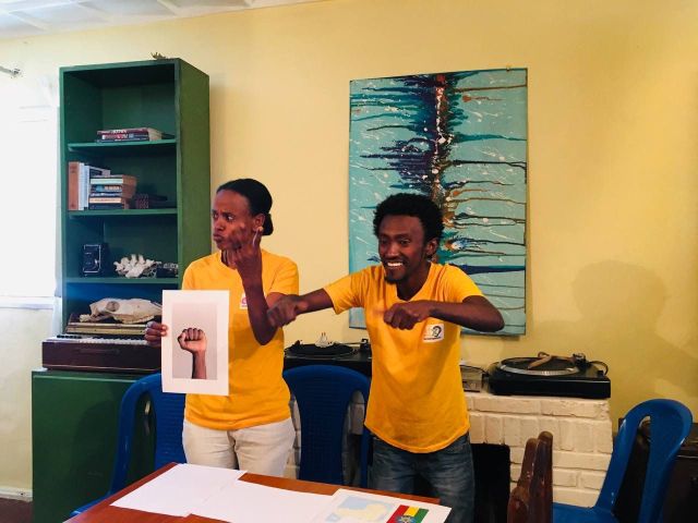 2 people excitedly presenting