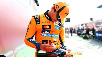 ZANDVOORT, NETHERLANDS - AUGUST 23: Race winner Lando Norris of Great Britain and McLaren signs a