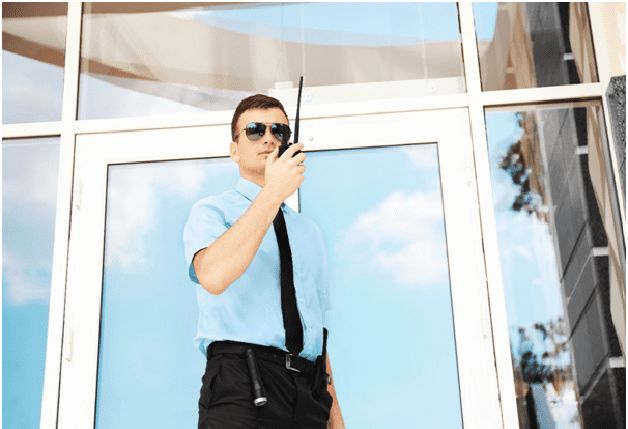 Security guard monitoring office building entrance in downtown Seattle