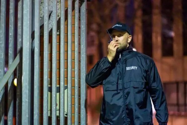 Security guard monitoring a commercial building entrance in Seattle