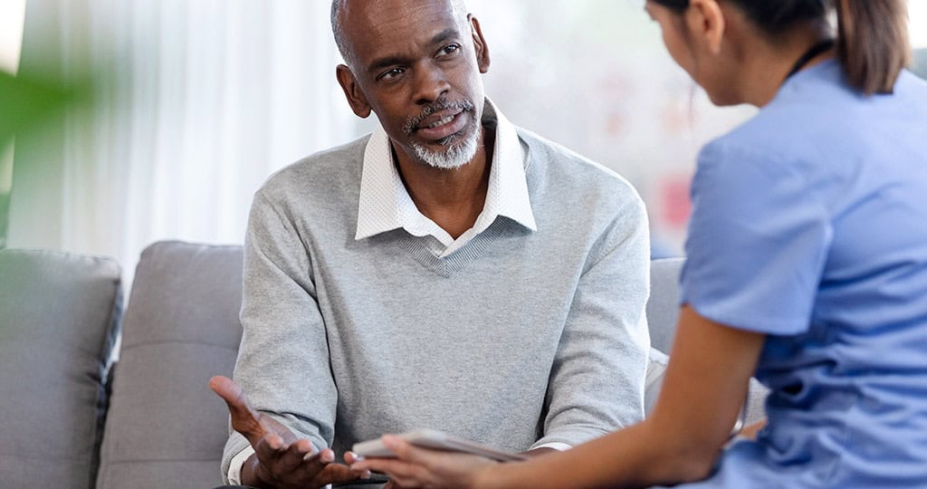 Senior man talking with doctor