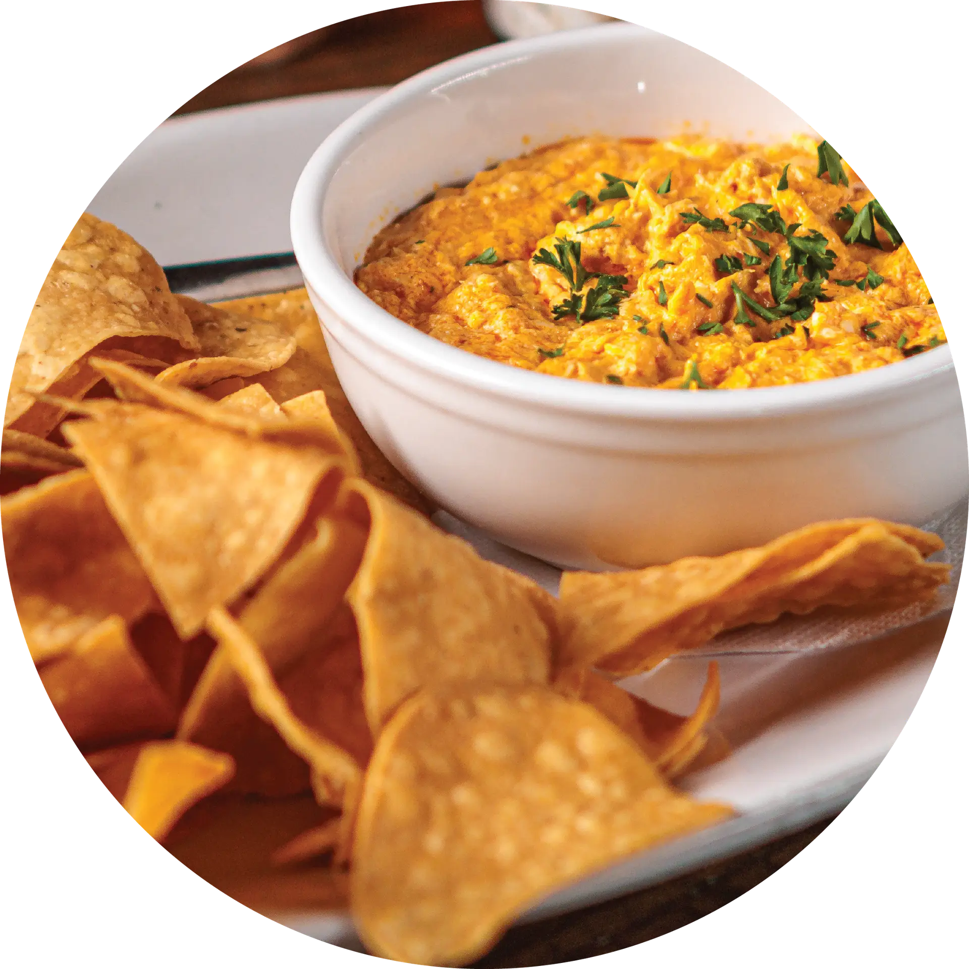 High-quality image of Buffalo Chicken Dip, served with tortilla chips, at Amici, beautifully plated.