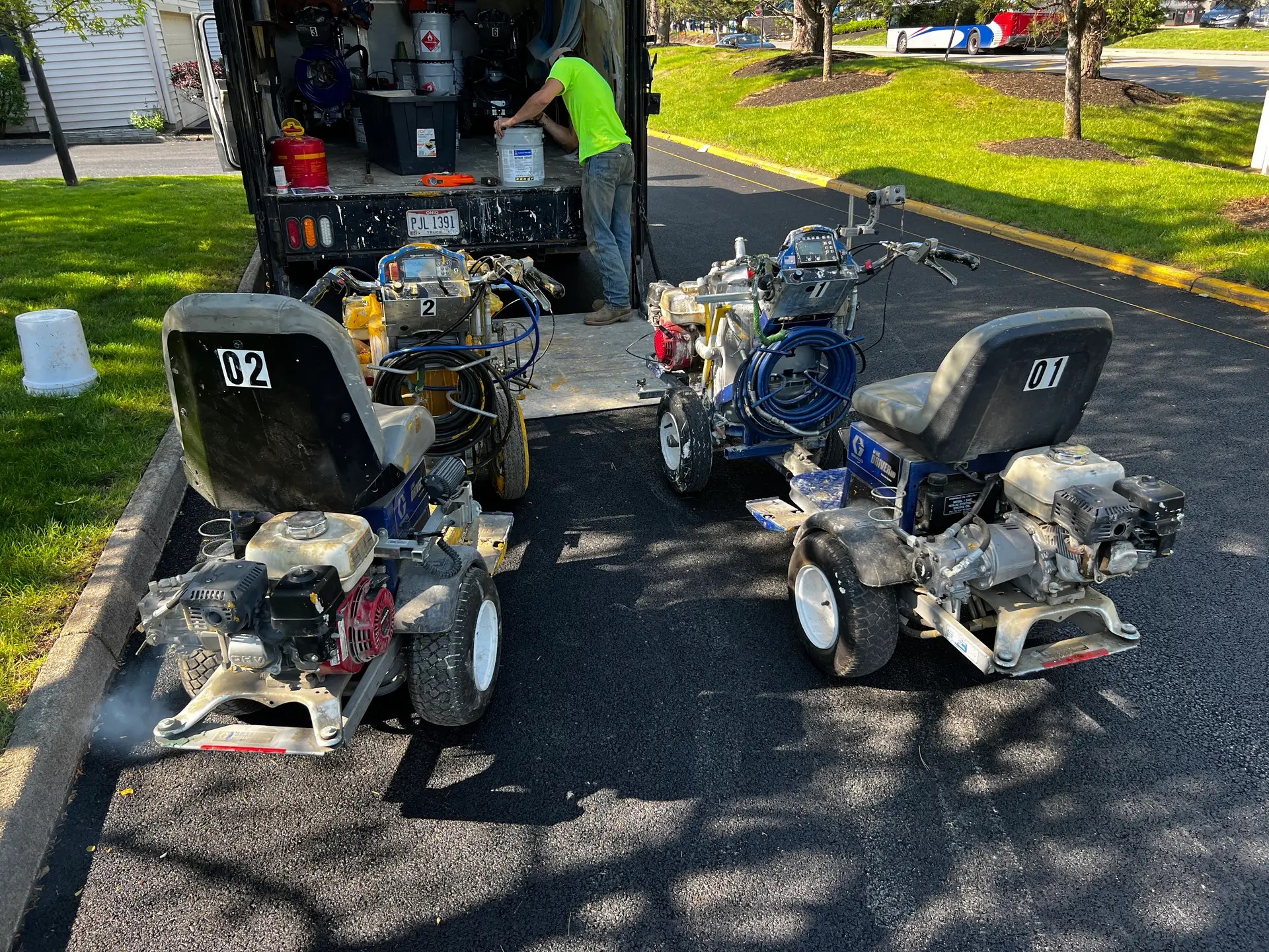 Three machines near a truck.