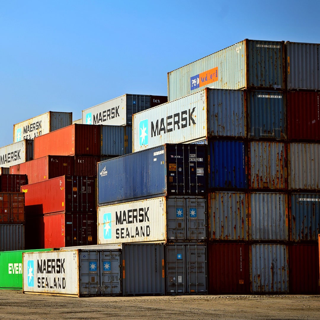 Containers stacked on top of each other with MAERSK logo on one side