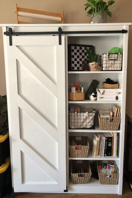 Jaime is a shopping fanatic who loves pottery barn. Homeschool Bookcase with Barn Door | Ana White