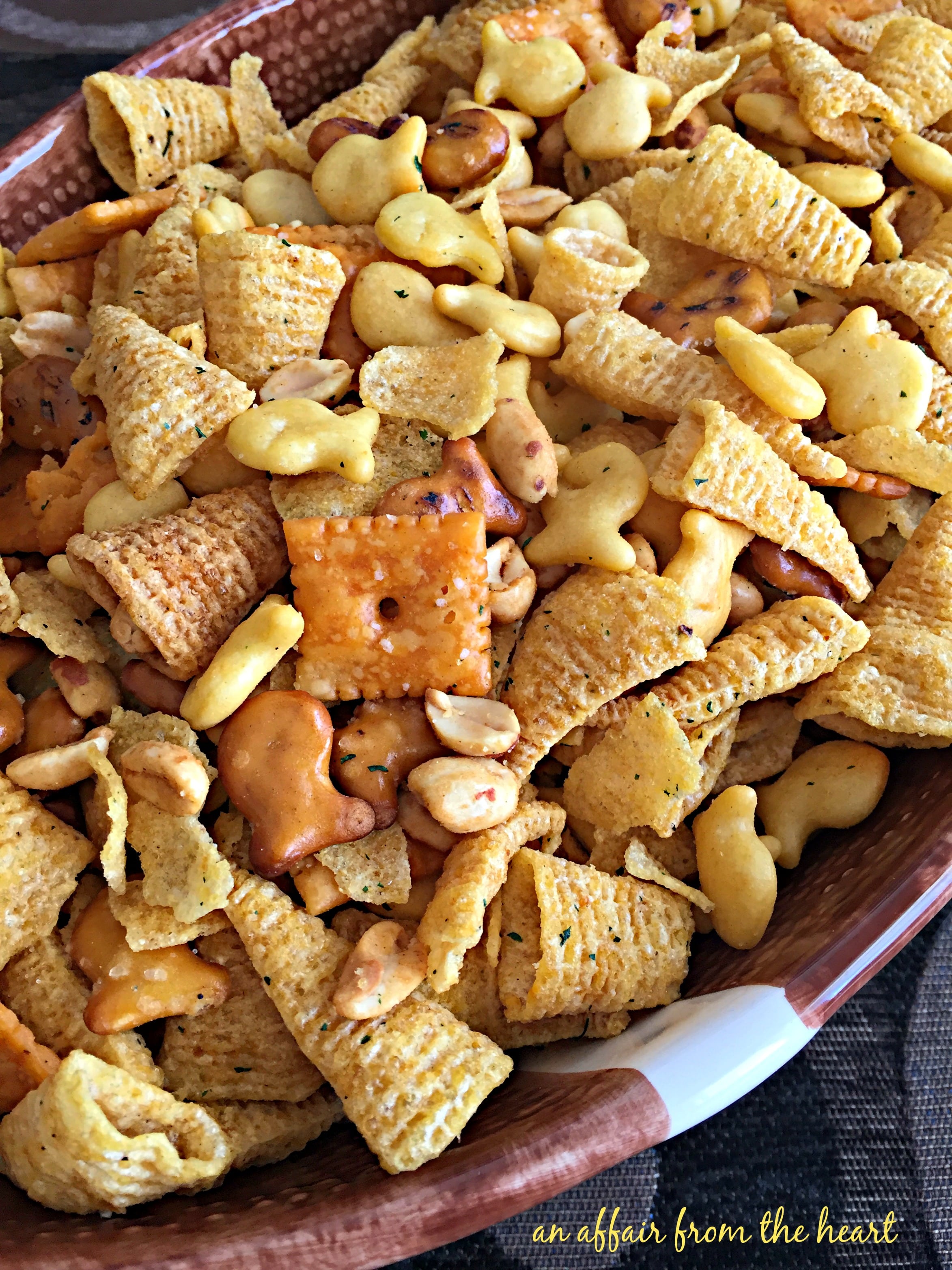Mix the bugles®, fritos®, cheetos® and mini pretzels together. This Touchdown Snack Mix Is So Buttery And Addicting Everyone Love It