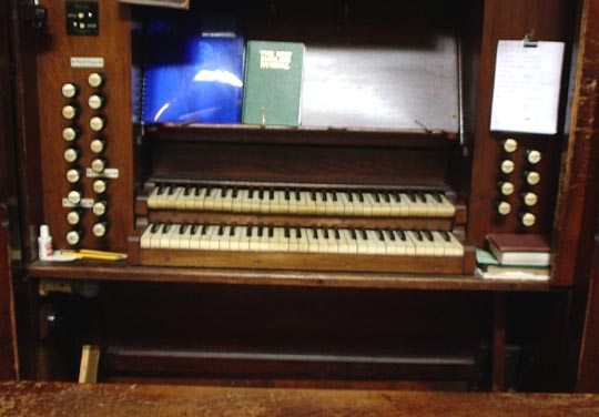 The console of the 1889 Alfred Monk pipe-organ in St Thomas the Apostle parish church, London N4, c.2009