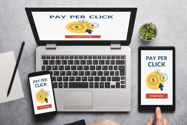Pay Per Click (PPC) concept on laptop, tablet and smartphone screen • Andrew Roche Drive More Traffic via Pay-Per-Click Advertising