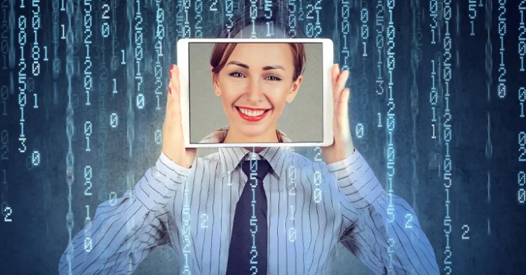 OnlineID_2 • Andrew Roche Woman holding a tablet with a smiling face over her own, surrounded by falling digital code representing data or cyberspace.