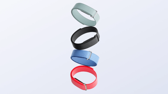 Four colorful bands arranged vertically, featuring a mint green, black, light blue, and red band, each secured with a silver buckle.