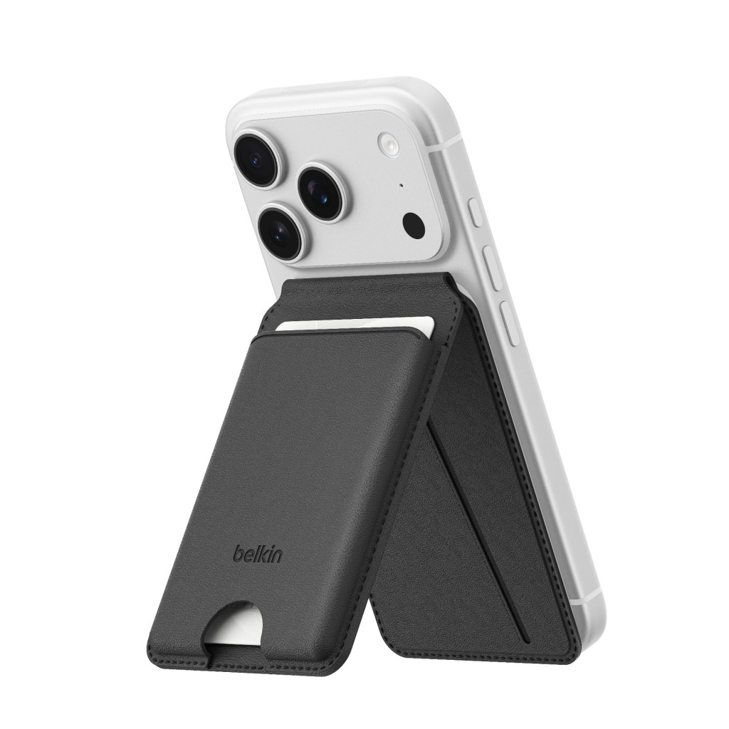 A white smartphone with three rear cameras and a detachable black wallet case attached, designed to hold cards and serve as a stand.