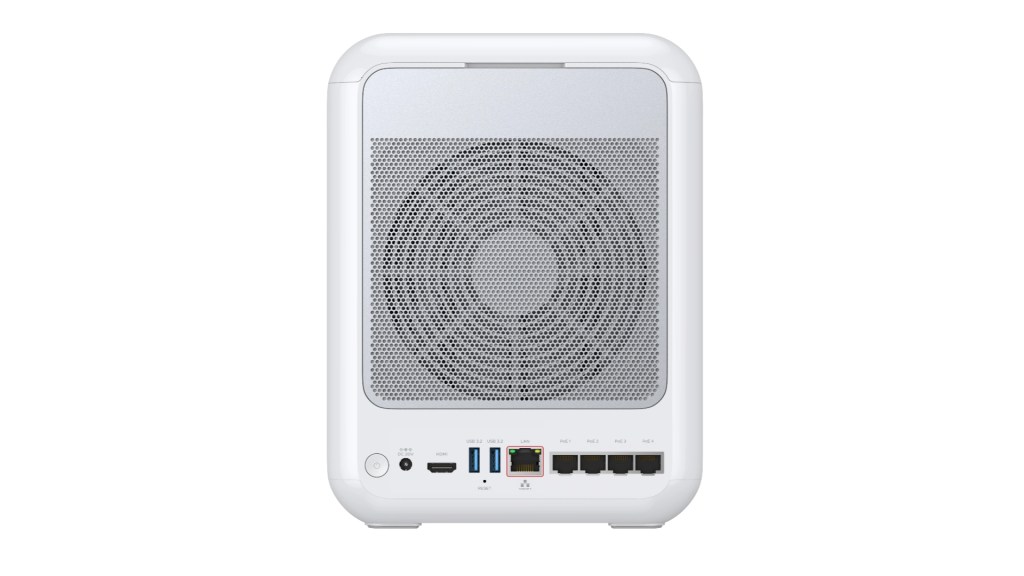 A white computer case viewed from the back, featuring a mesh fan design and various ports including USB, HDMI, and Ethernet connections.