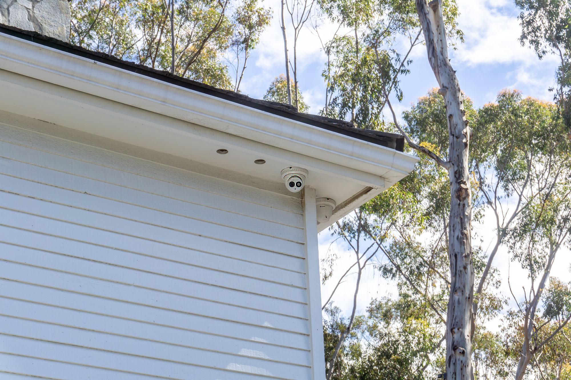 Outdoor security cameras installed under the eaves of an Andrus project in Rancho Santa Fe.