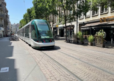 Photo of a tram in a downtown street Strasbourg France.