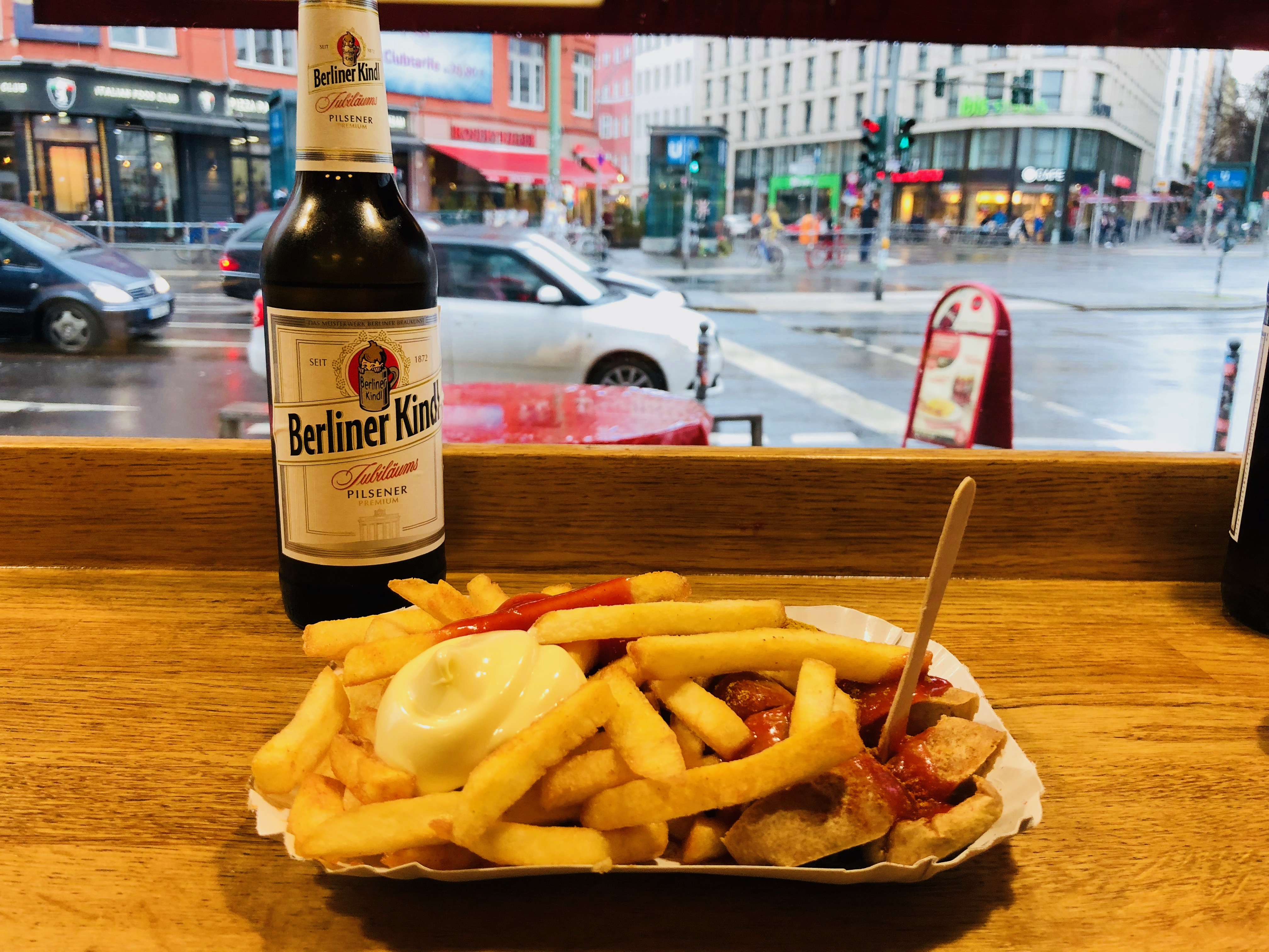 photo of currywurst and berlin beer