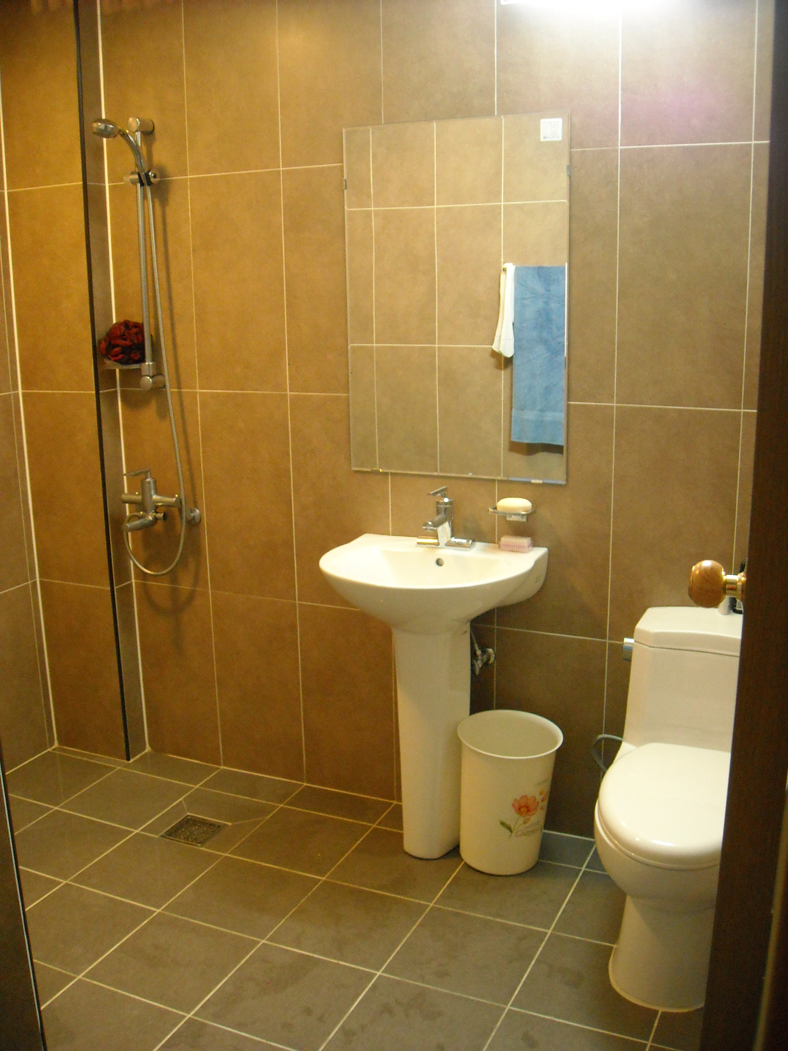 All-In-One bathrooms in DGEV teacher dorms. The shower head reaches most of the area so that makes it easy to clean!