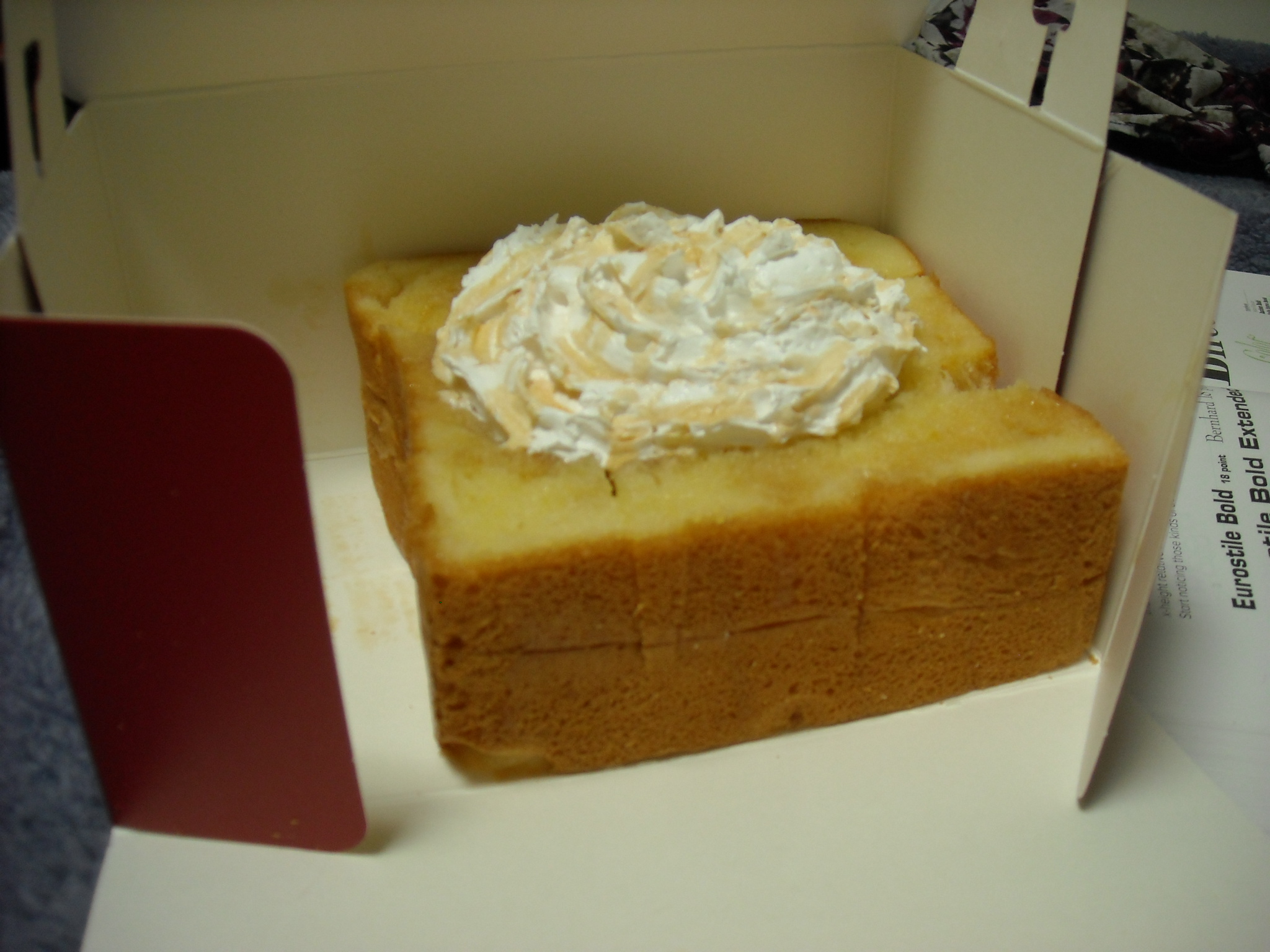 Honey bread from the goody-case at the coffee shop. Yum. But basically a large chunk of Wonder Bread with syrup and whipped cream.