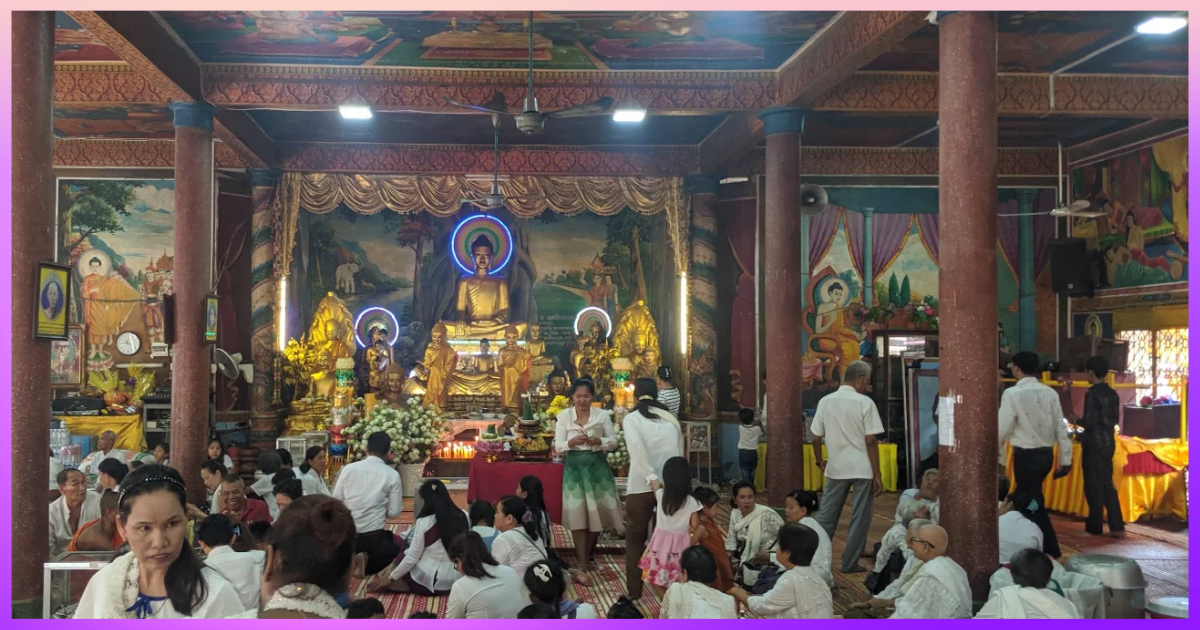 Families praying inside the hall during Pchum Ben in Phnom Penh at Sansam Kosal Pagoda