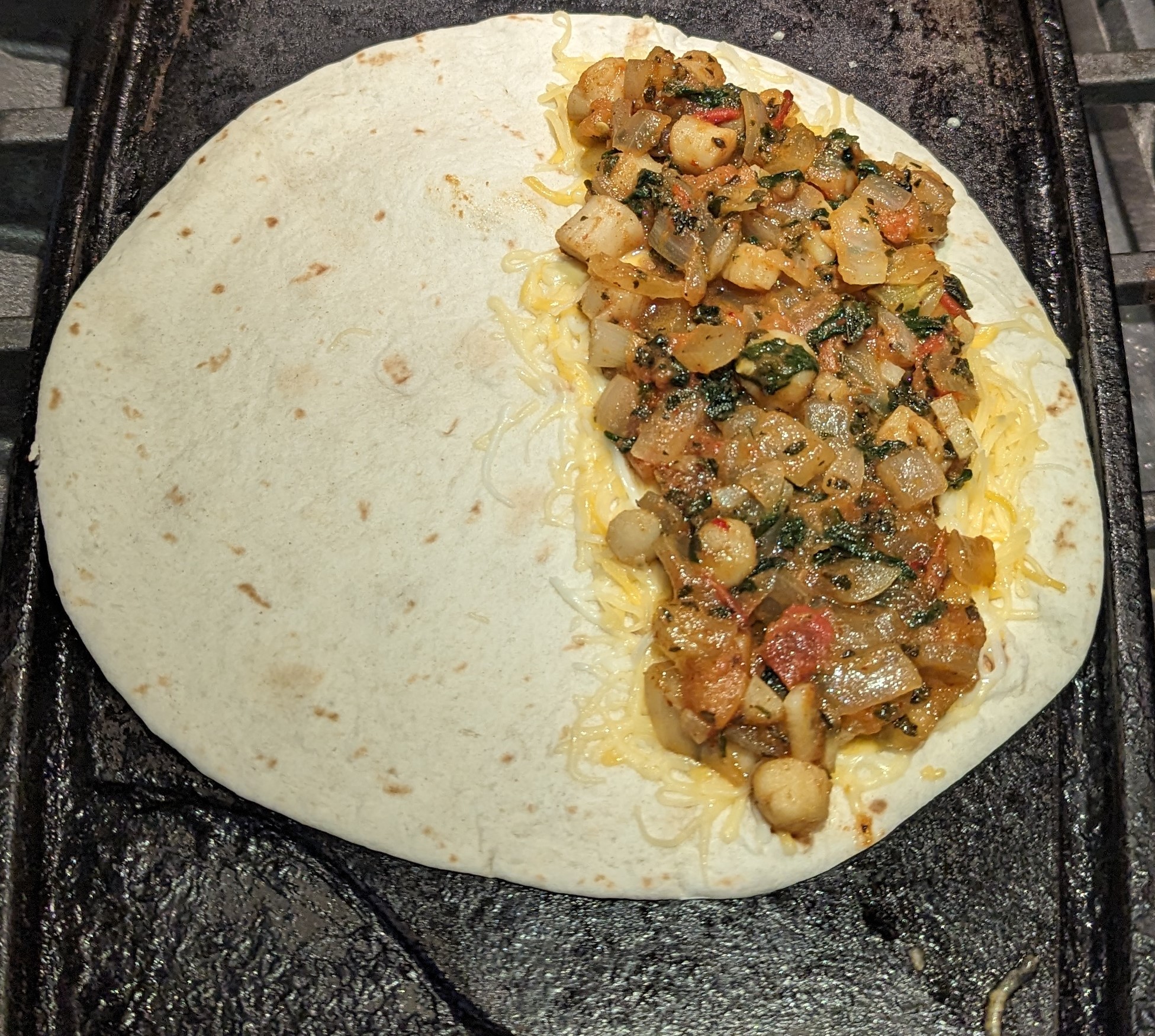 What the quesadilla looks like on the inside during the cooking process.