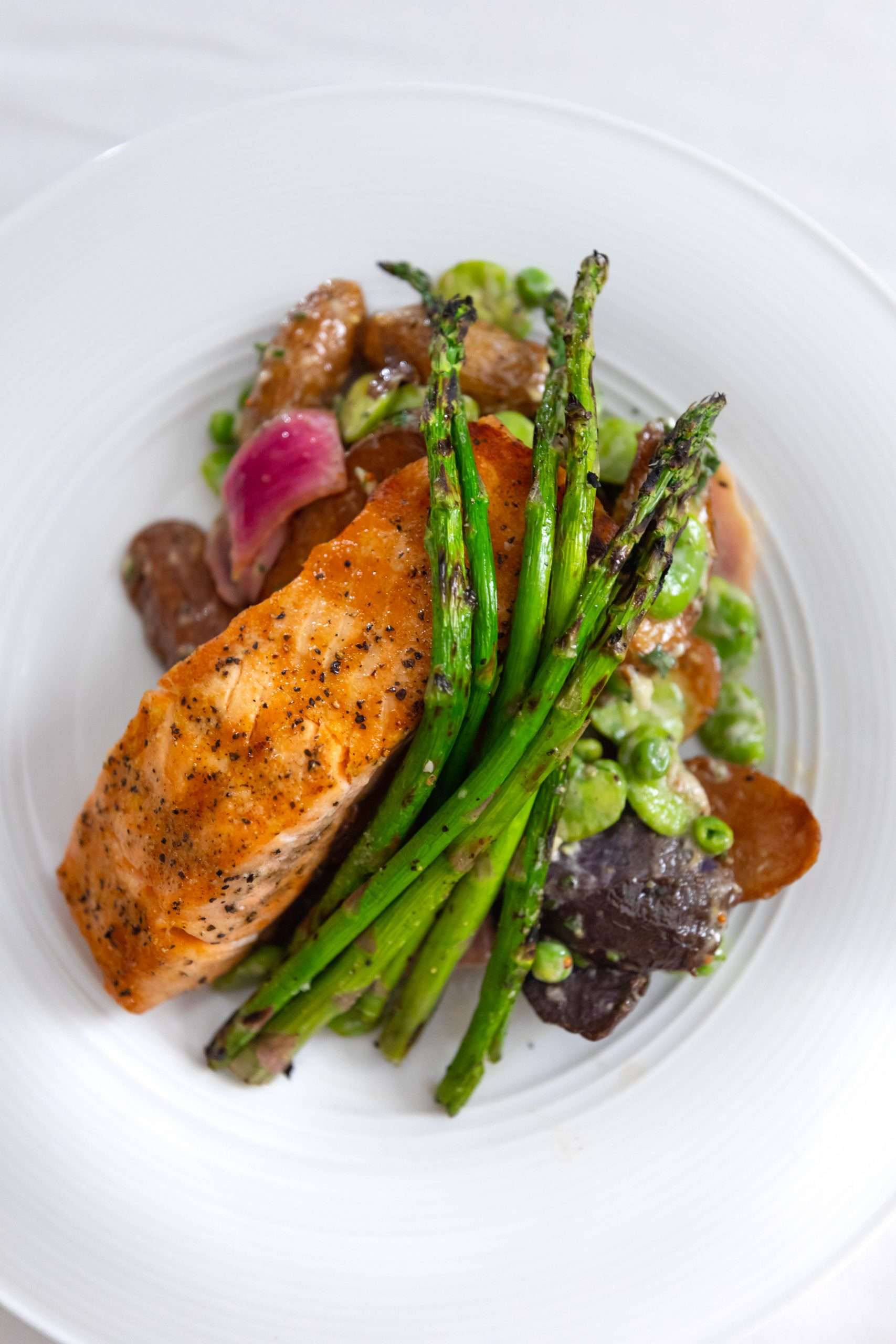 Aerie Restaurant at Grand Traverse Resort & Spa in Acme Traverse City Michigan Photographed by Annie Fairfax Grilled Atlantic Salmon Smoky Fingerling Potato Salad with Fava Beans, Pickled Onion Grilled Asparagus, Cider Gastrique