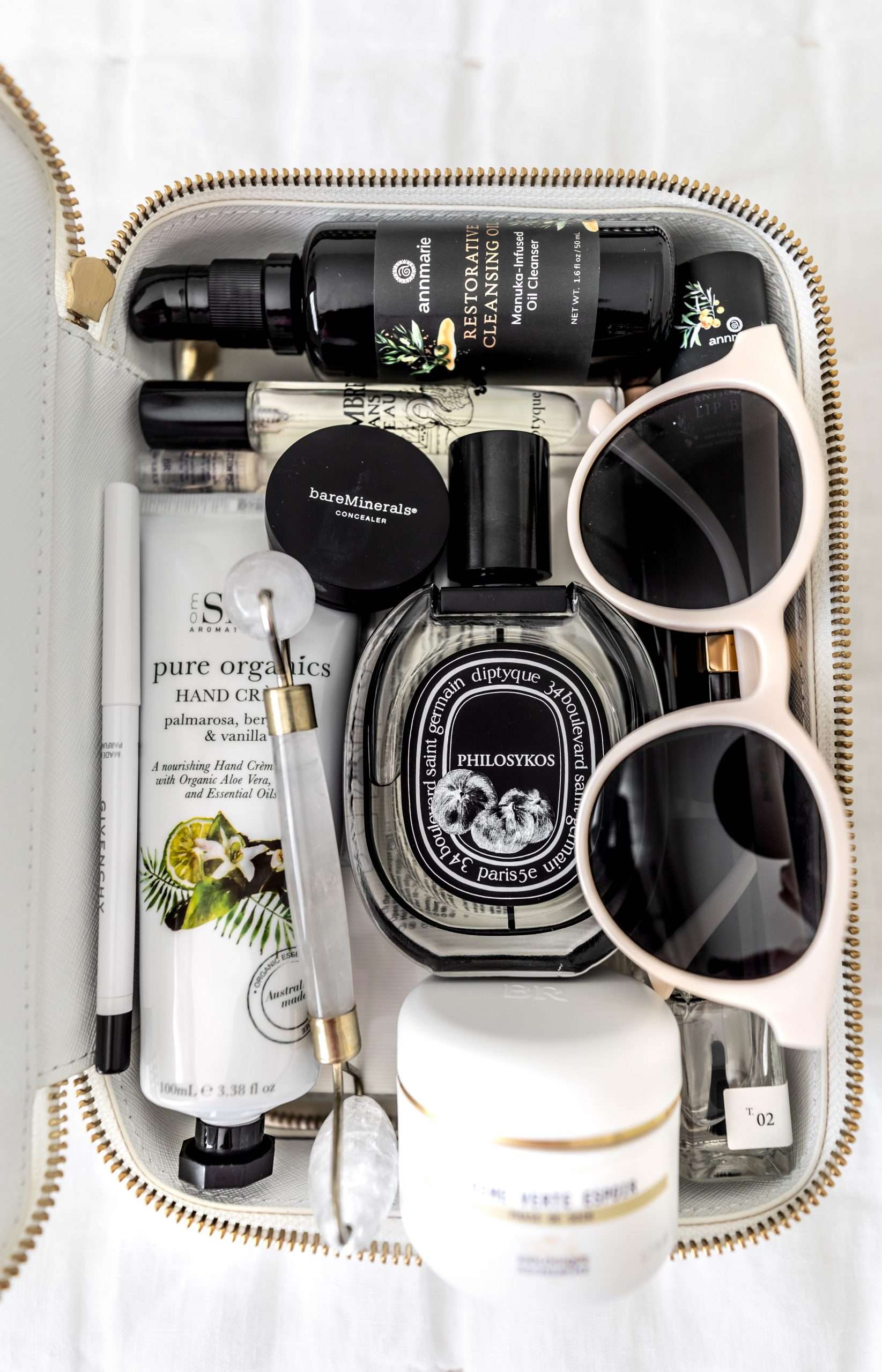 How I Pack My Cosmetics When I Travel Using Truffle Diptyque Perfume Bare Minerals Concealer Biologique Recherche Creme Verte Espoir, Annmarie Cosmetics Resorative Manuka Honey Cleansing Oil Travel Essentials by Annie Fairfax