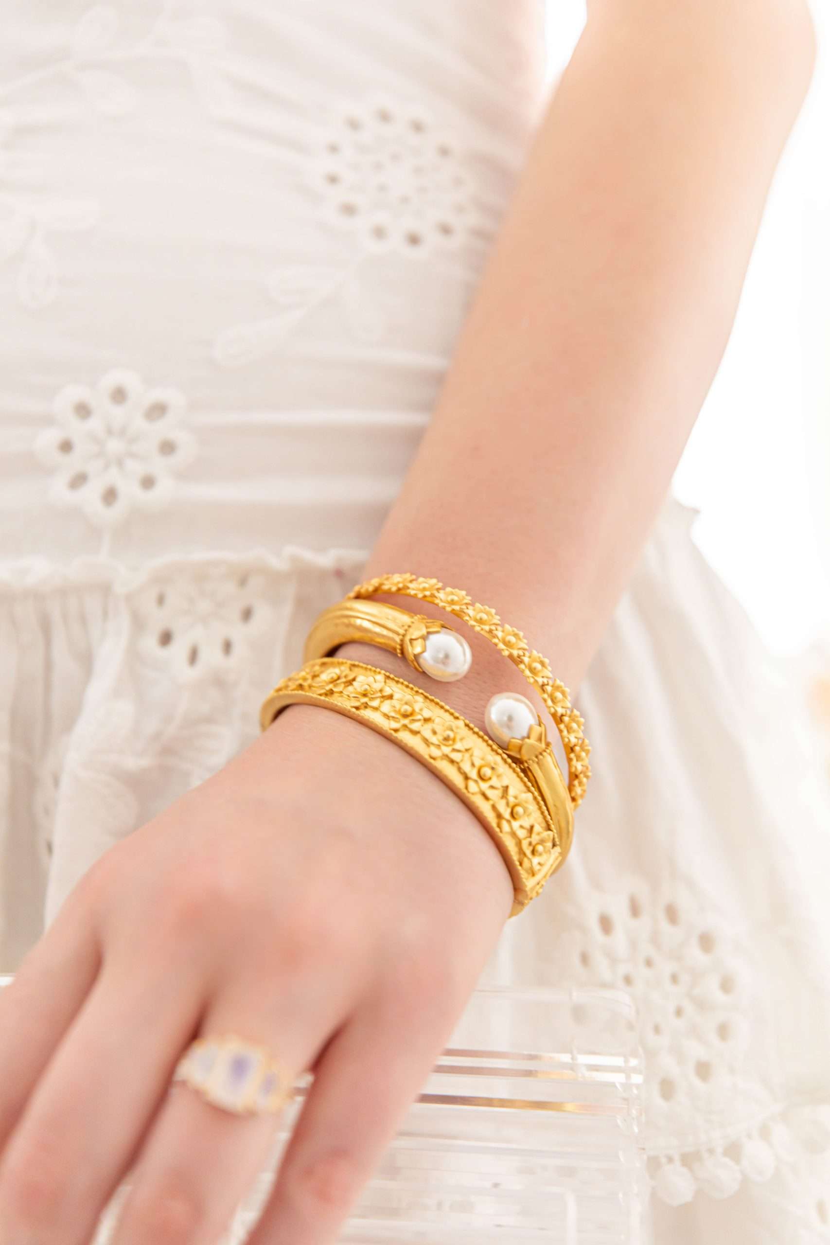 Sunday Stack Volume 15 White O.P.T. Eyelet Dress Cult Gaia Clear Acrylic Ark Bag Susan Shaw Necklace Julie Vos Bracelets White Palm Beach Sandals Long Curly Hair Worn and Styled by Luxury Travel and Lifestyle Creator Annie Fairfax