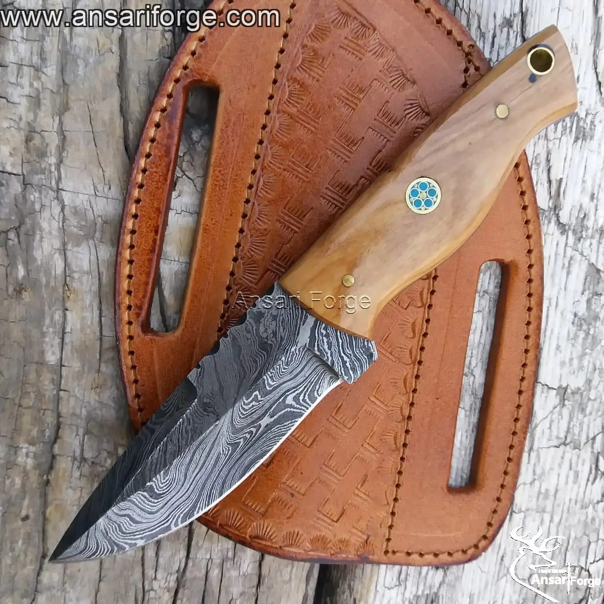 Ansari Forge Damascus EDC knife displayed alongside camping gear, highlighting its suitability for outdoor adventures.