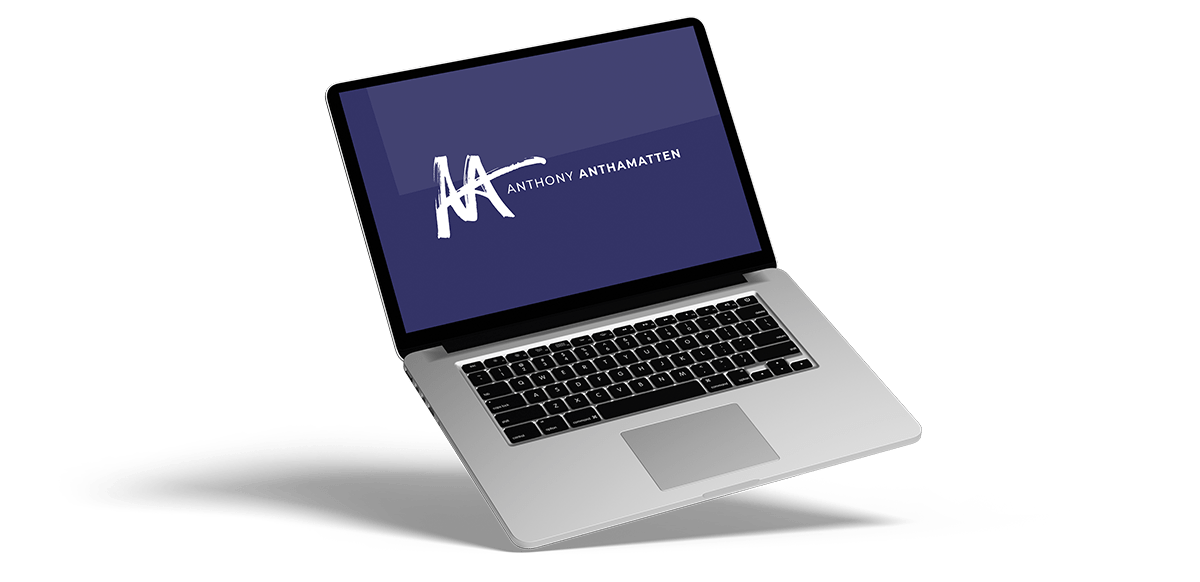 Titled laptop with the Anthony Anthamatten logo on a purple screen