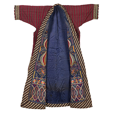 TURKOMAN EMBROIDERED COAT GORGAN, IRAN, CIRCA 1950 Handspun and handwoven silk, machine embroidery with silk thread, gold-coloured cord Length 40 in (102 cm), Sleeve span 35.25 in (90 cm)