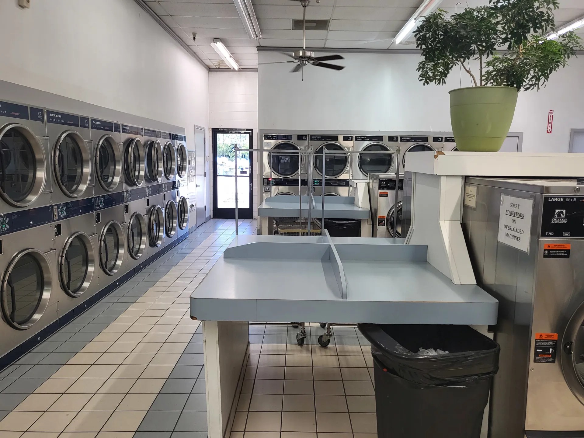 Apartment building coin operated laundry center.