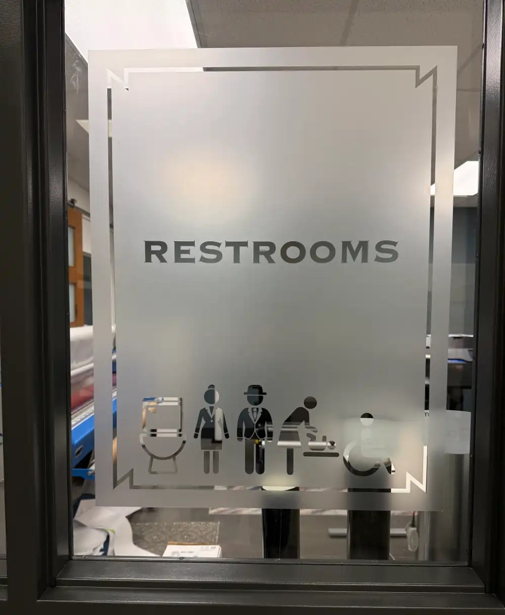 Custom frosted window graphics installed on commercial office windows for privacy and branding