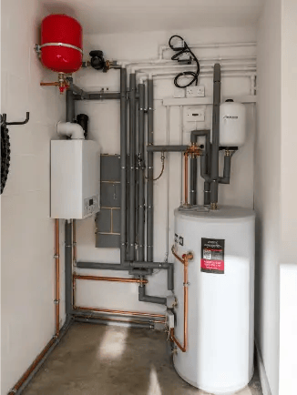 Combi boiler pressure gauge and filling loop under a boiler