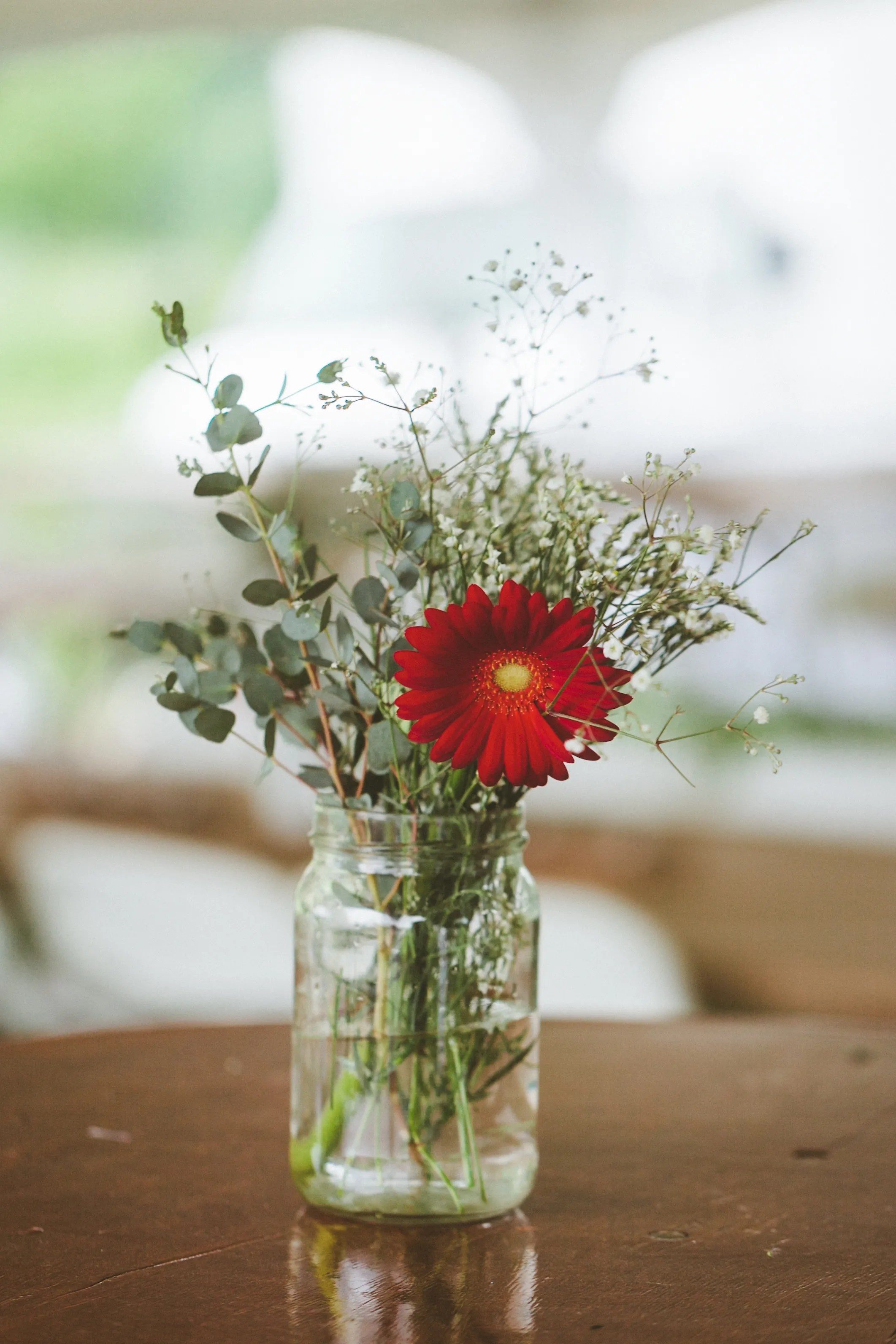 Every item on this page was chosen by a town & country editor. Red Gerbera Daisy and Baby\'s Breath Centerpiece