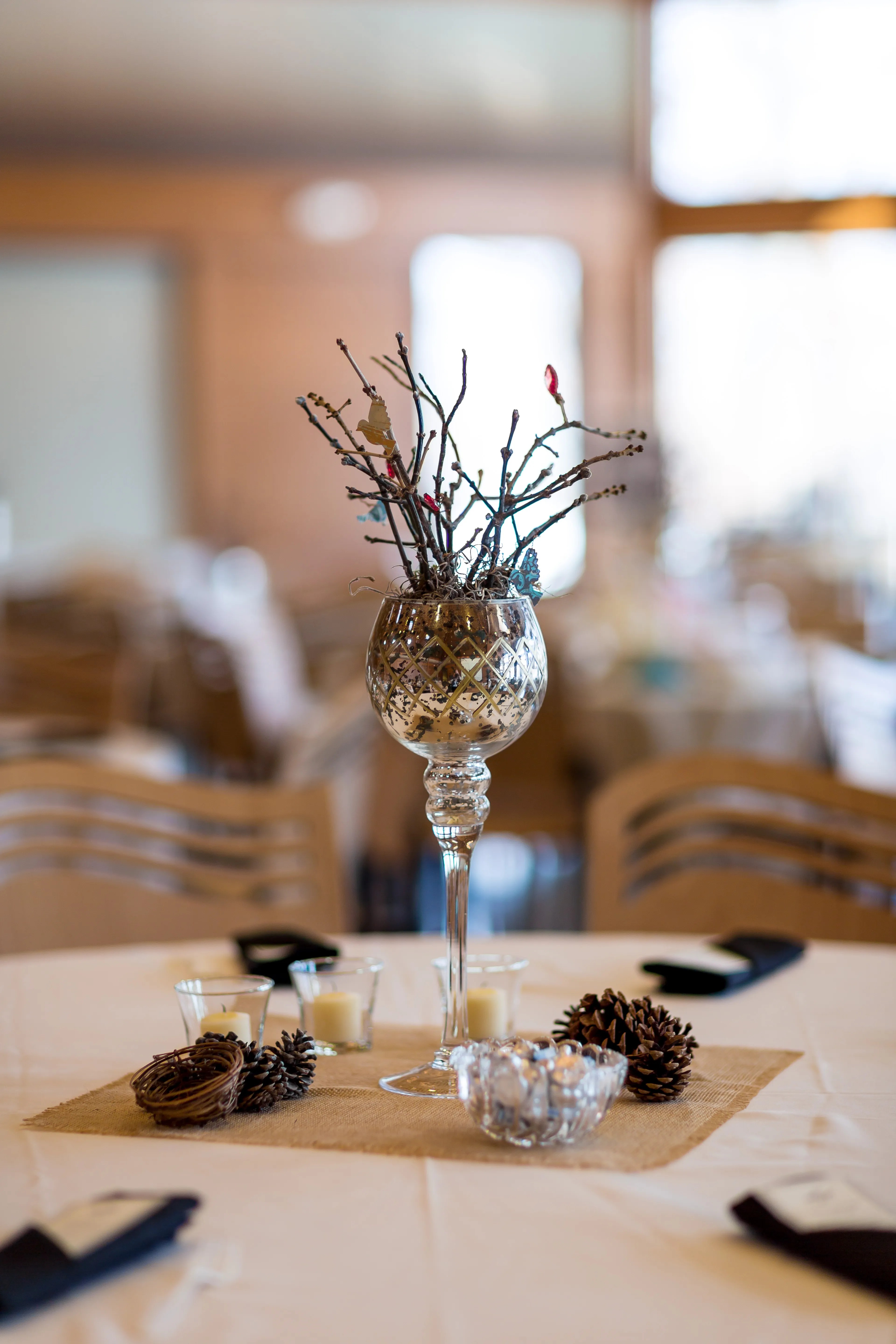 Three drawers offer storage for small items like tv remotes, papers and more. Rustic Wine Glass Centerpieces with Pinecones and Branches