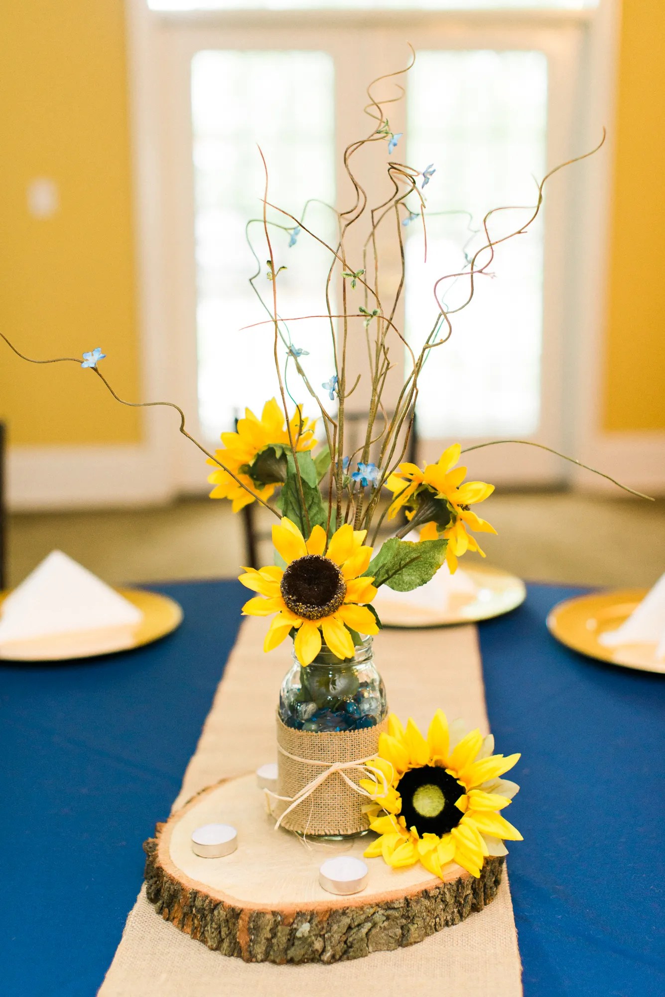 While everyone may be looking forward to the big day, there are plenty of other celebrations that shouldn't be forgotten, namely the bridal shower. Low Sunflower Centerpiece in Glass Jar