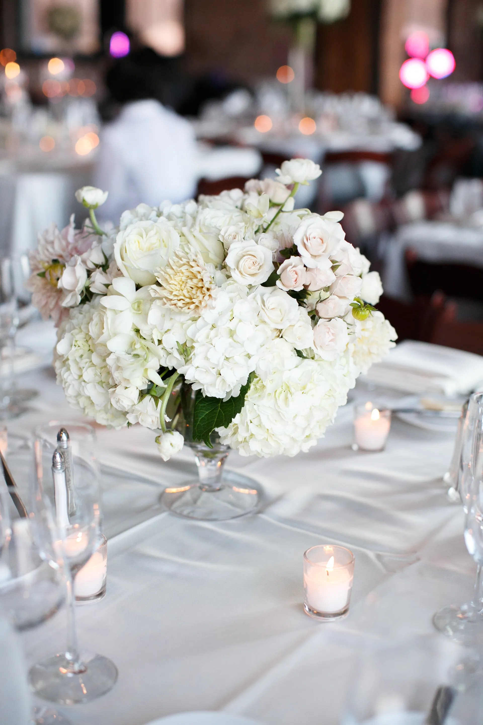 This post contains references to products from one or more of our advertisers. Simple, Classic White Hydrangea, Rose Centerpieces