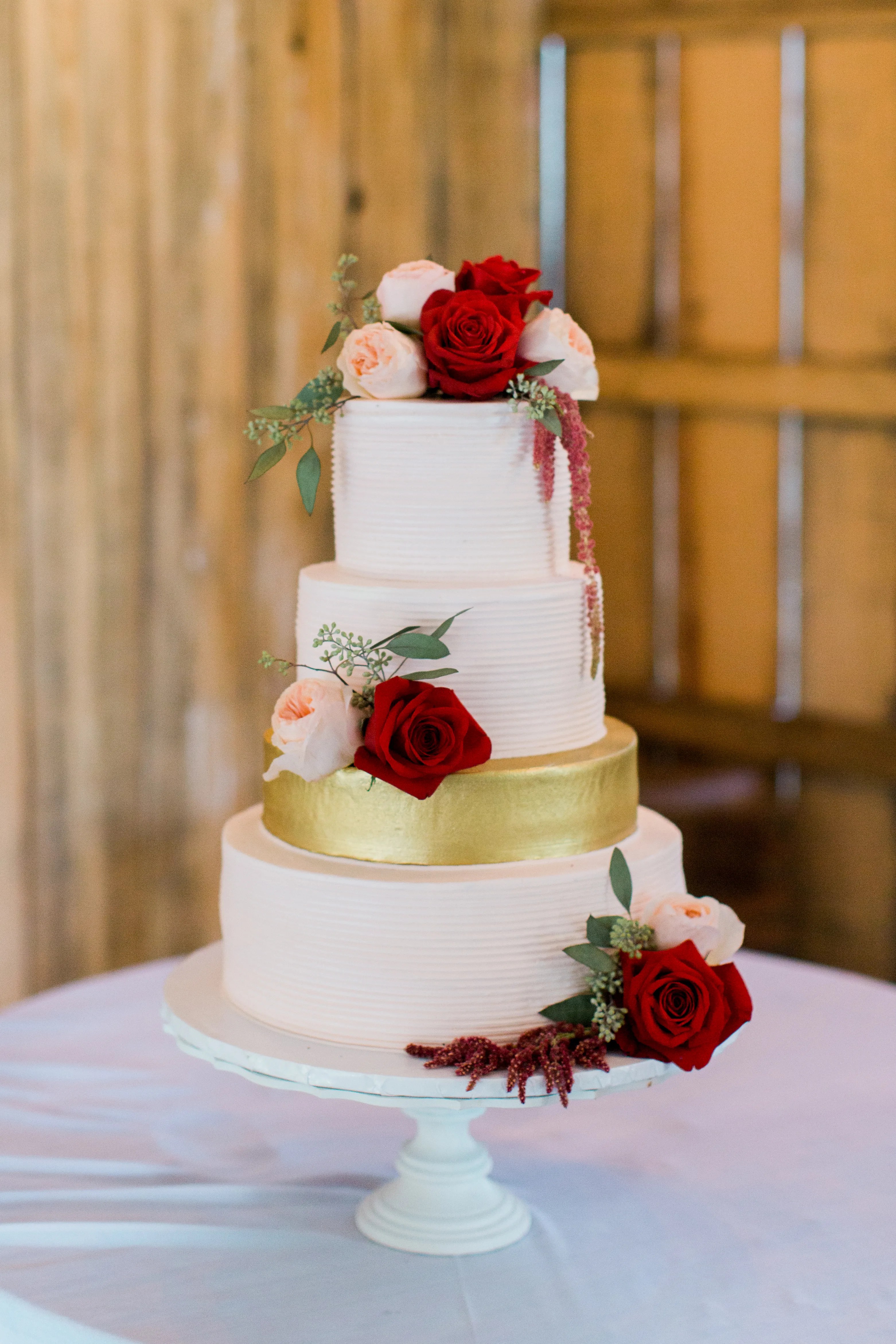 Find your dream barn wedding venue in west yorkshire only on weddingplanner.co.uk. Romantic White Wedding Cake With Burgundy Flowers