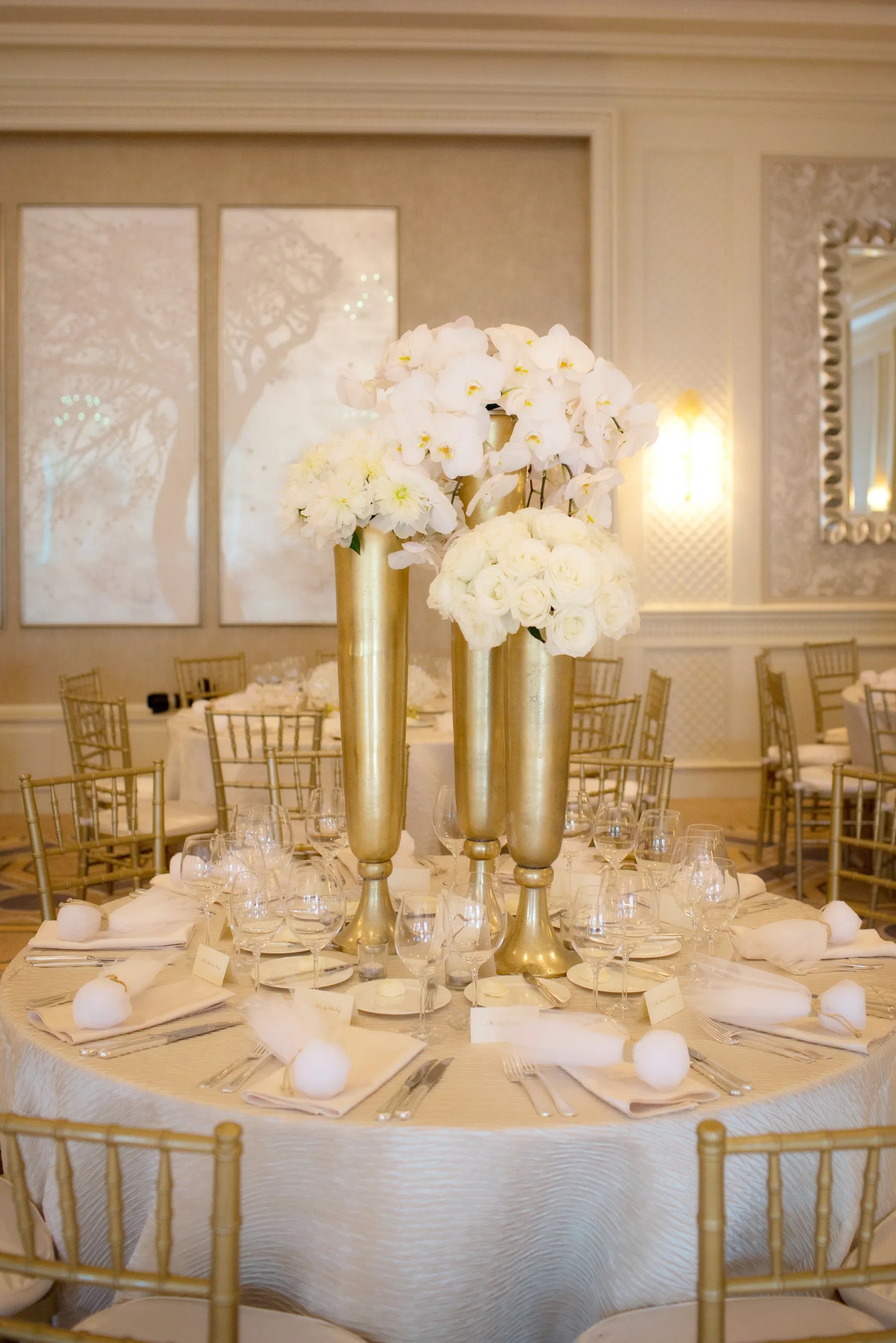 · the wedding planner's costs and the services on offer · the planner's portfolio and . White Floral Centerpieces in Tall Gold Vases