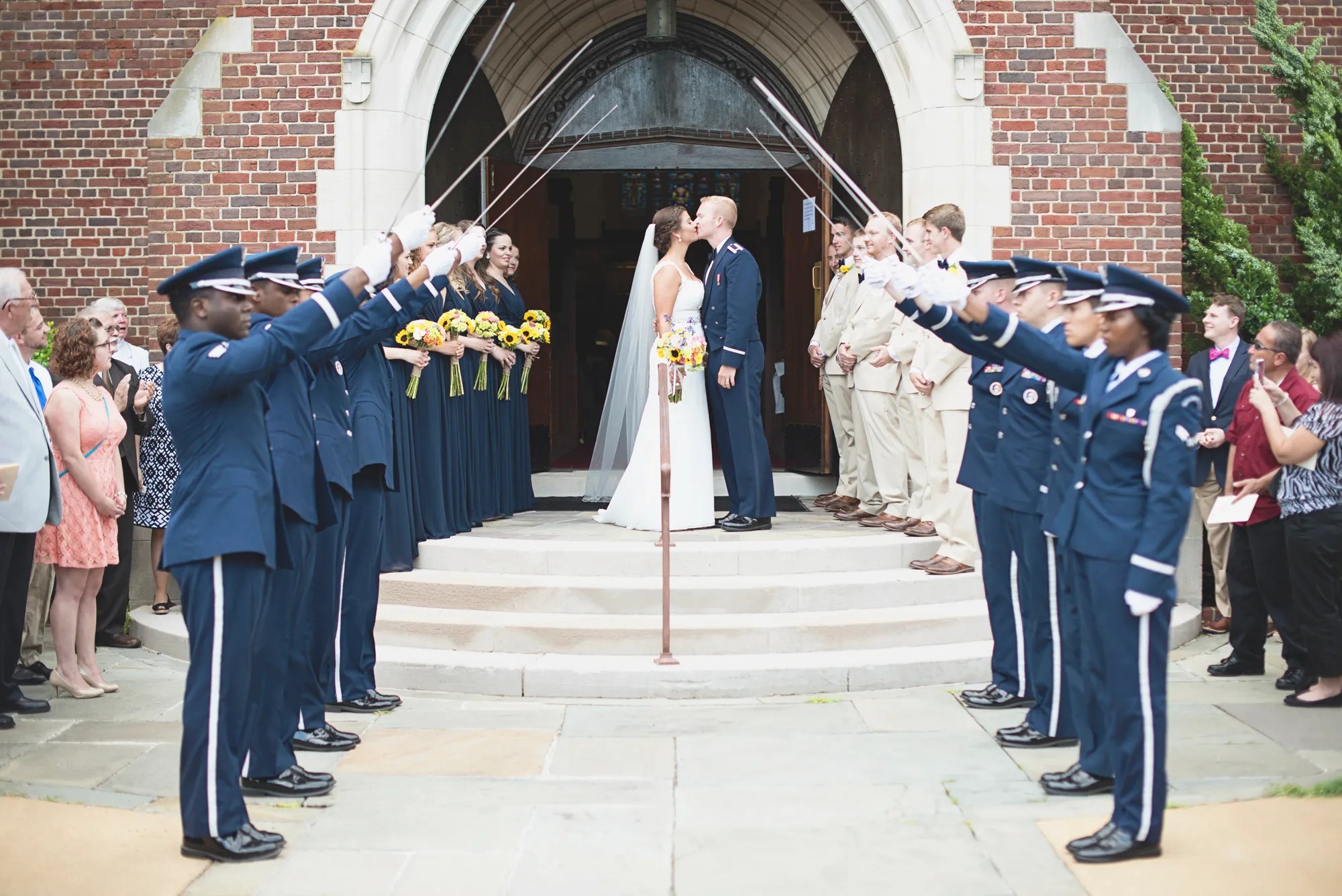 The honor guard form two lines opposite each other. Air Force Saber Arch Recessional