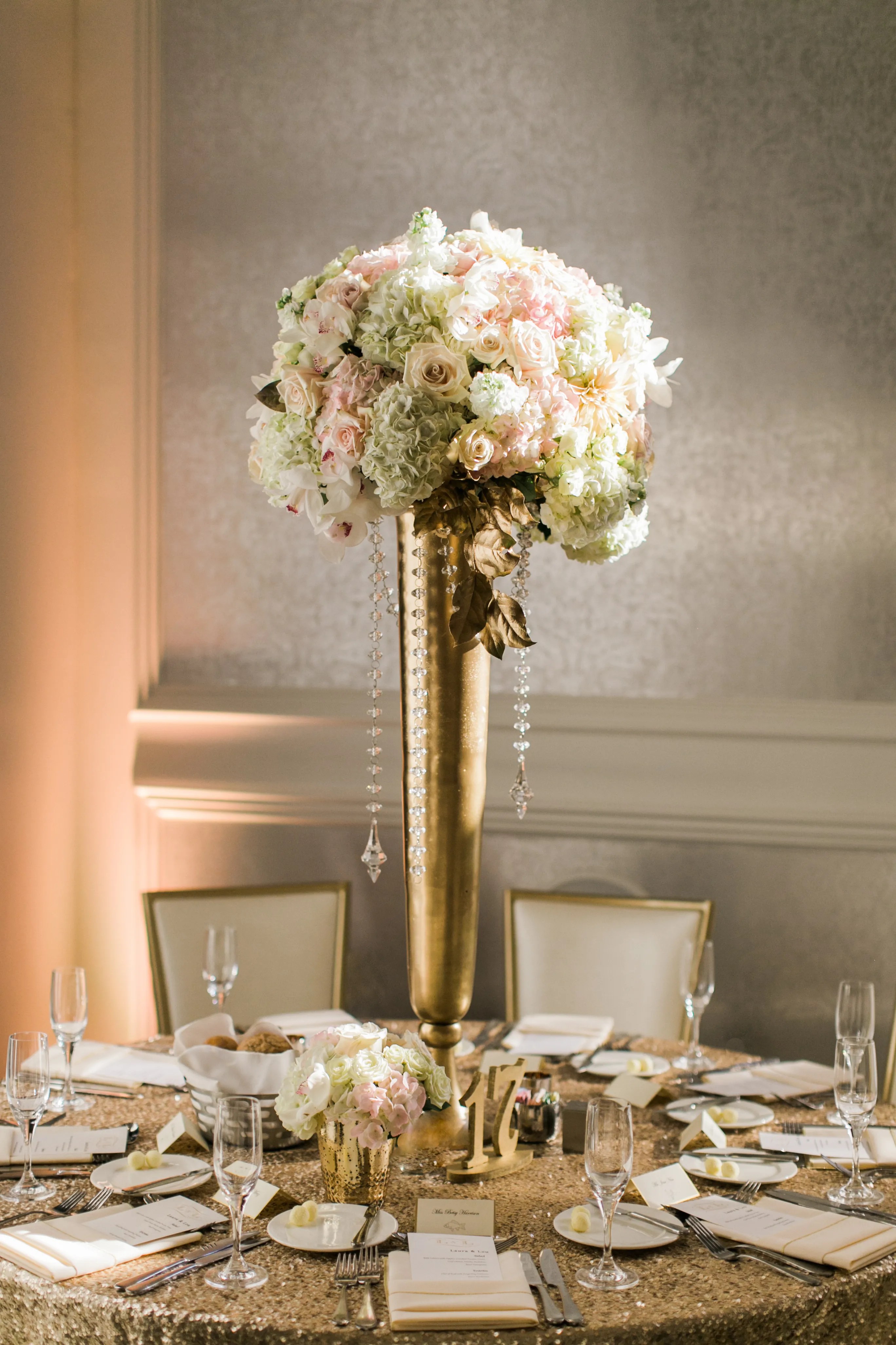 Your friend has announced her engagement, and now you have received the wedding invitatio. Tall Gold Vase Centerpiece