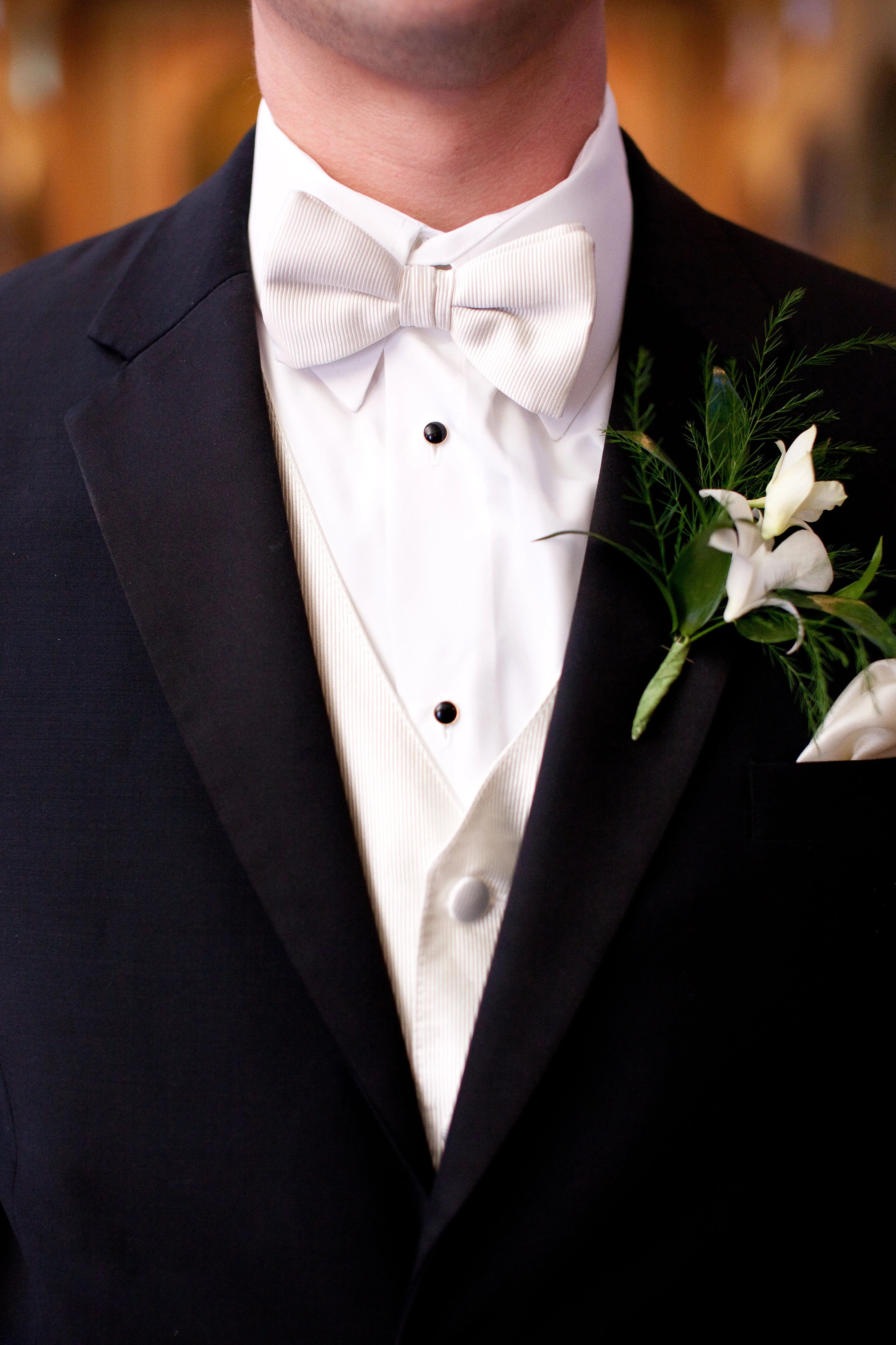 Basically, this dress code lets wedding guests off the hook if they absolutely cannot . Groom in Black Tux with White Bow Tie