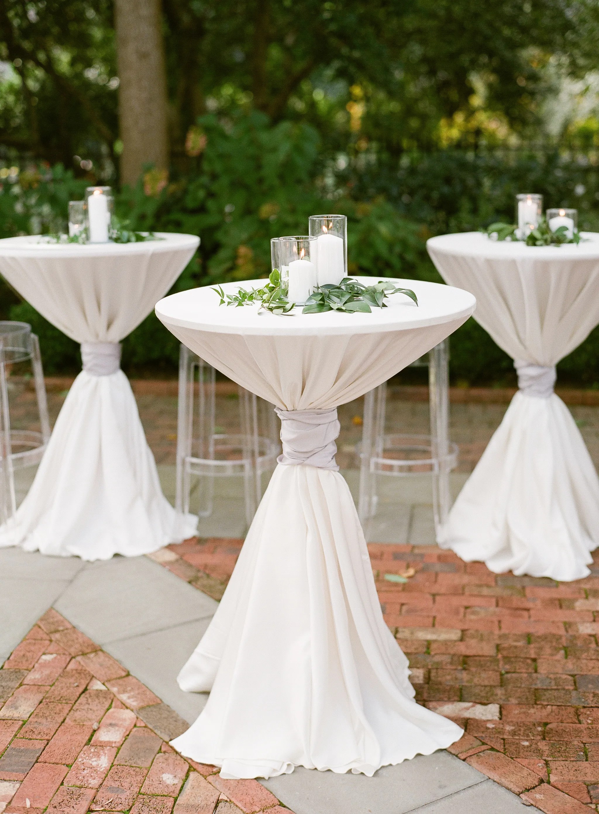 Read reviews and get unbiased, expert product recommendations. White Pillar Candles and Greenery Atop Cocktail Tables
