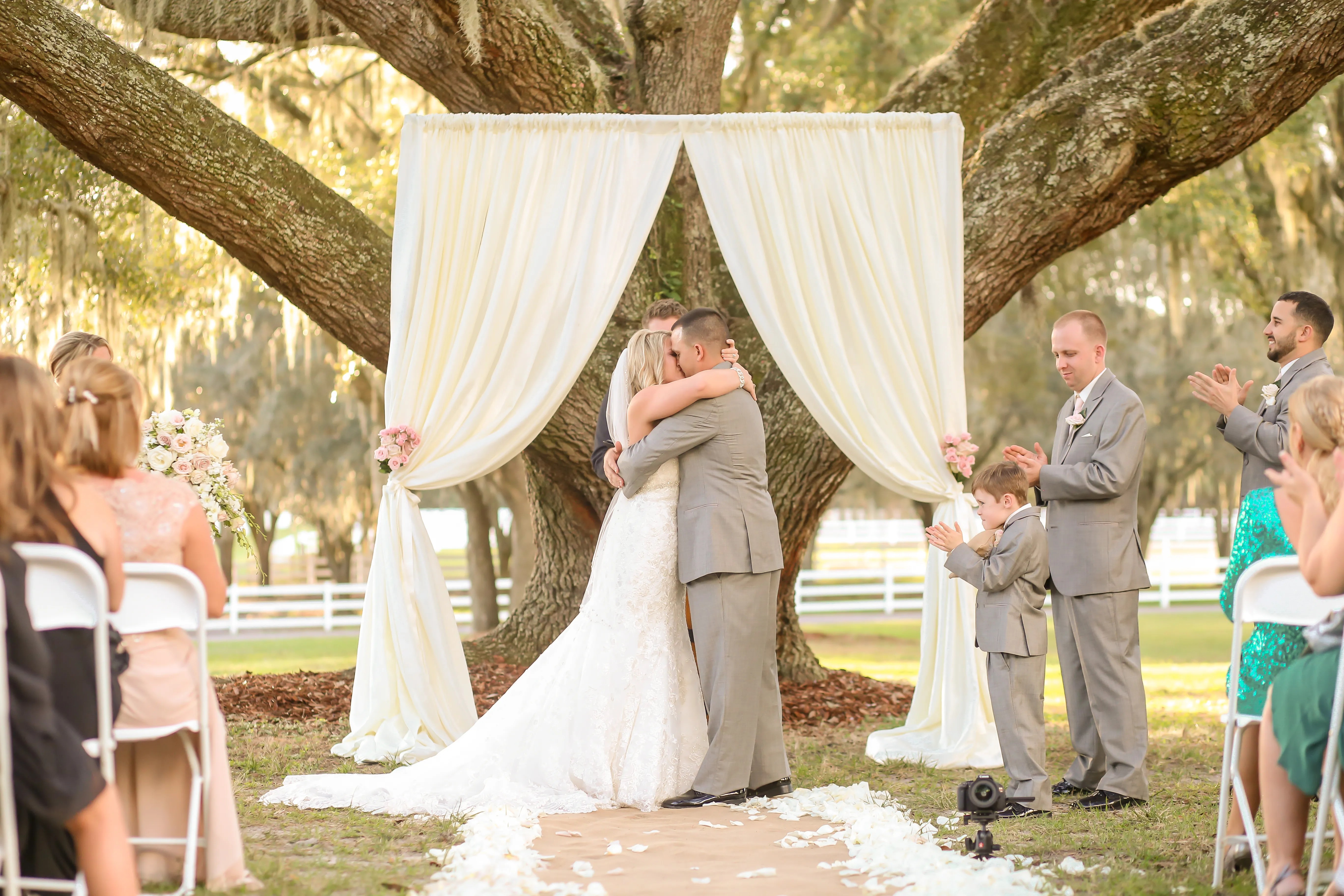 Enter the newest trend in the wedding world. Simple Ivory Fabric-Draped Wedding Arch