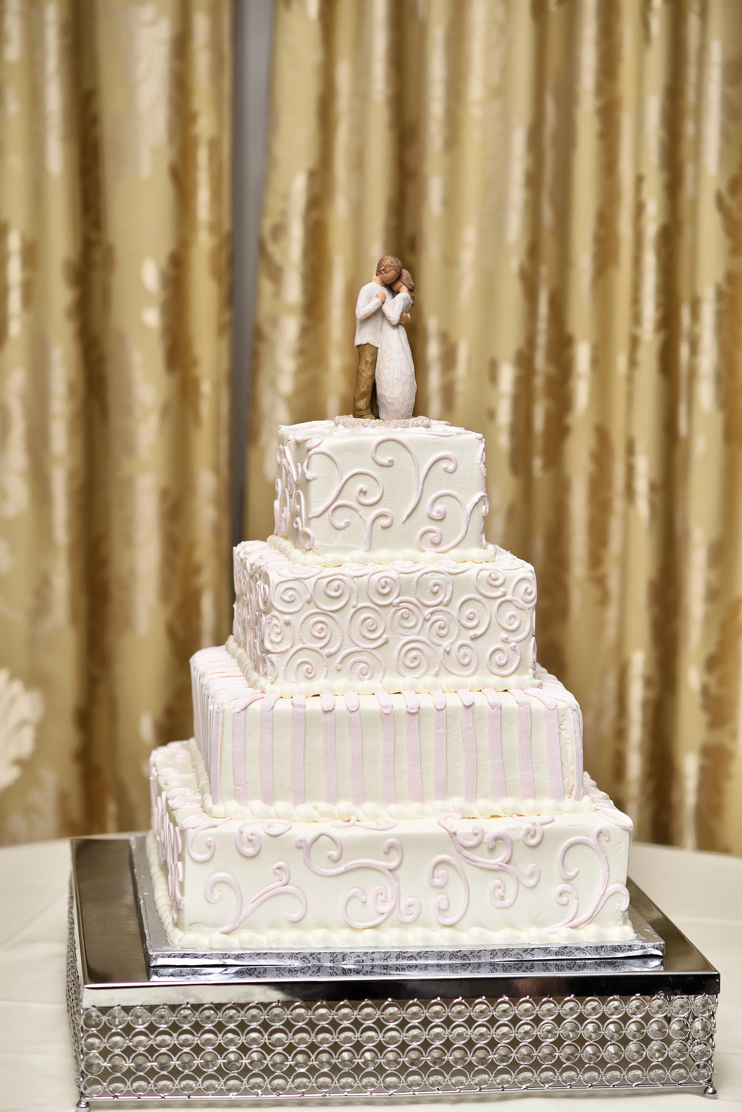 The archetype of a bridal shower is not super exciting. Ivory Buttercream Four-Tier Wedding Cake
