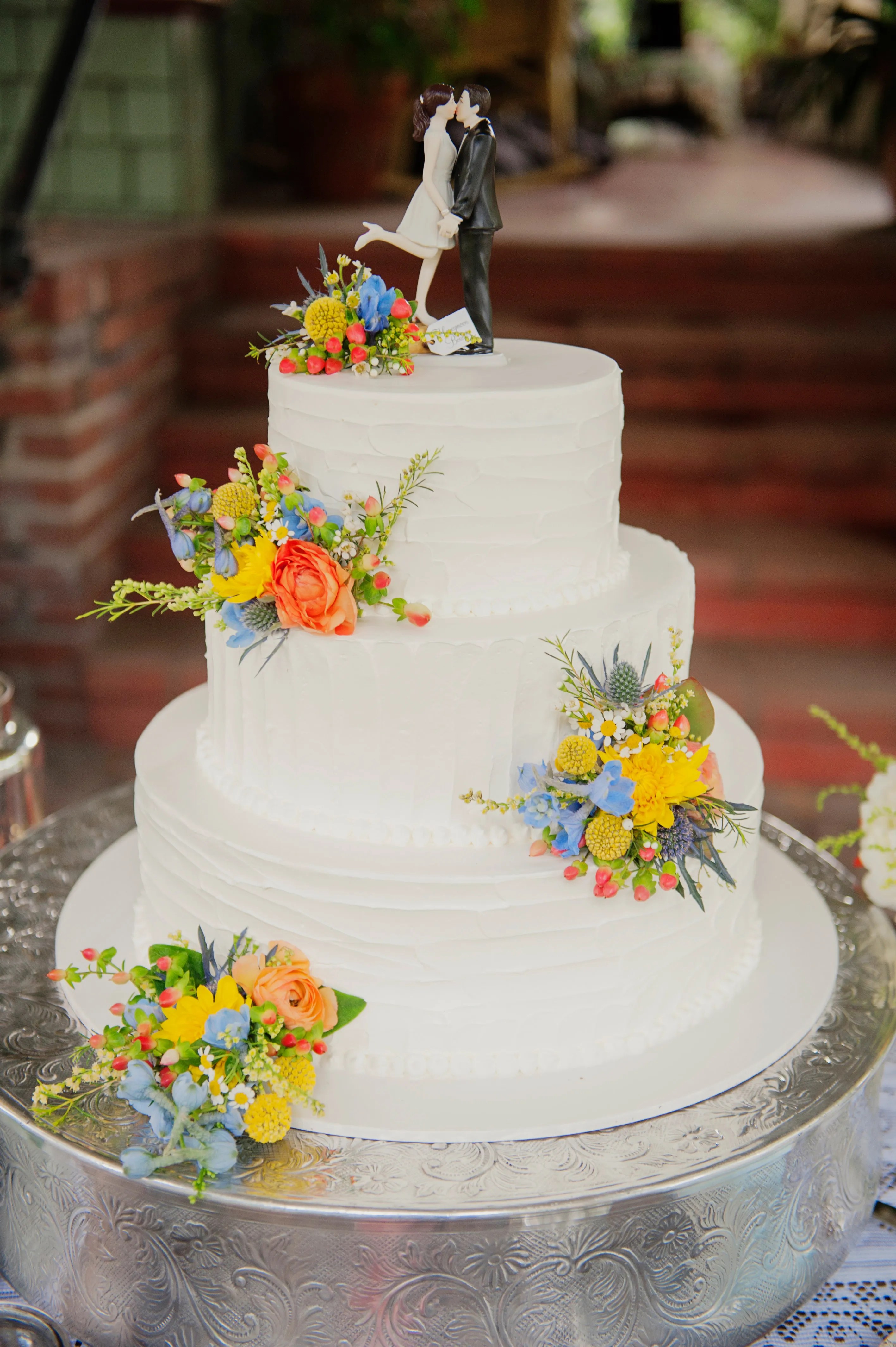 Courthouse, apply for your marriage . White Wedding Cake With Colorful Flowers