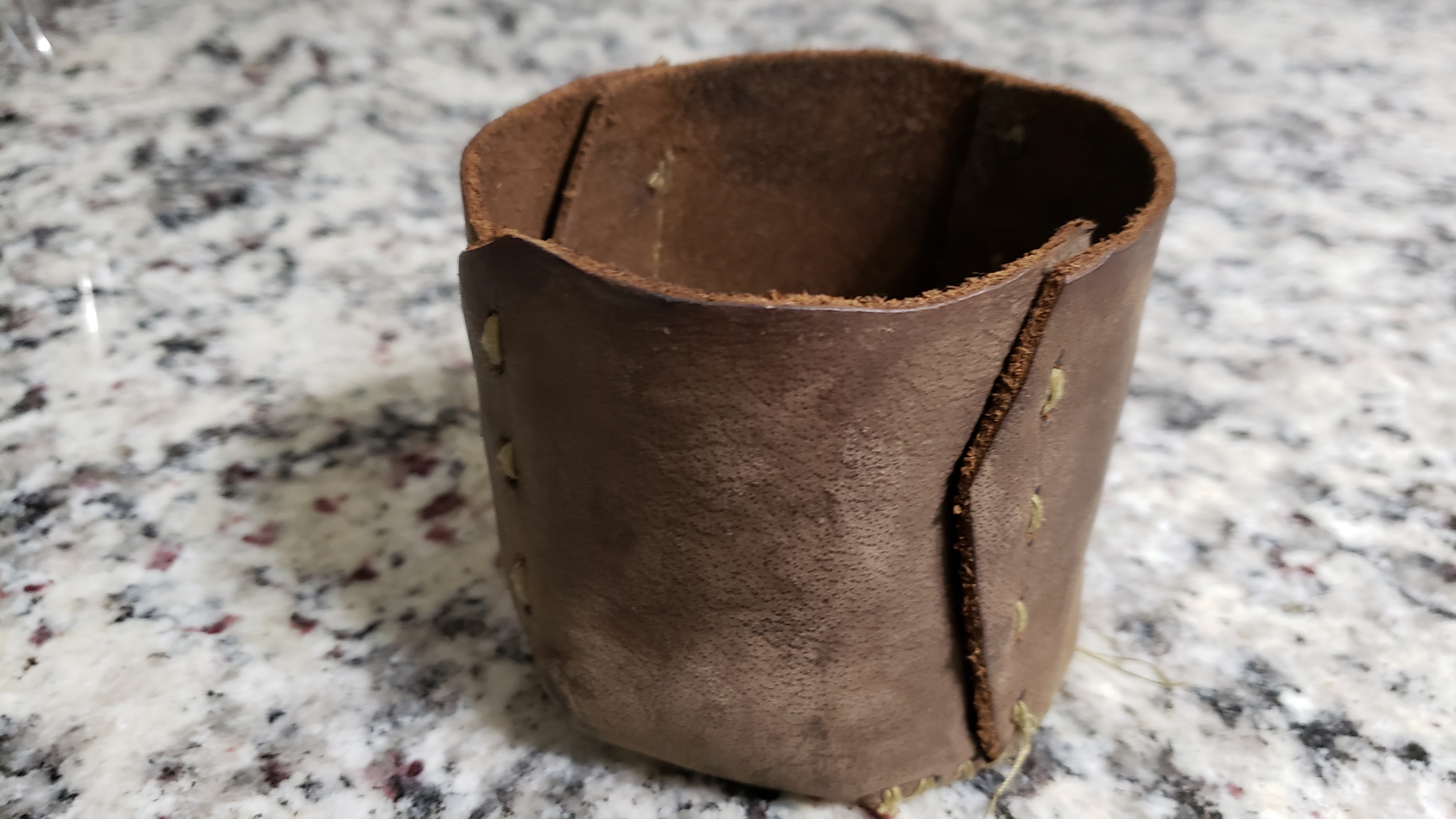 Empty coozy is useful as a cup for small items when not being used for the mug.